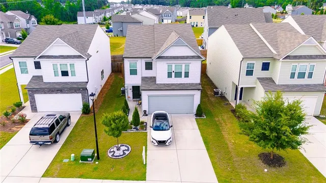 aerial view of residential houses with swimming pool