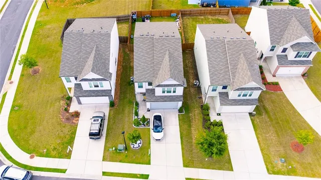 aerial view of residential house with swimming pool