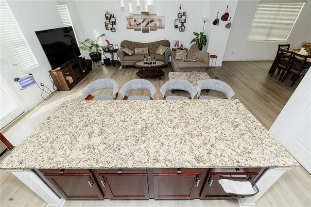 a view of living room with furniture and flat screen tv
