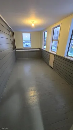 a view of a hallway with windows