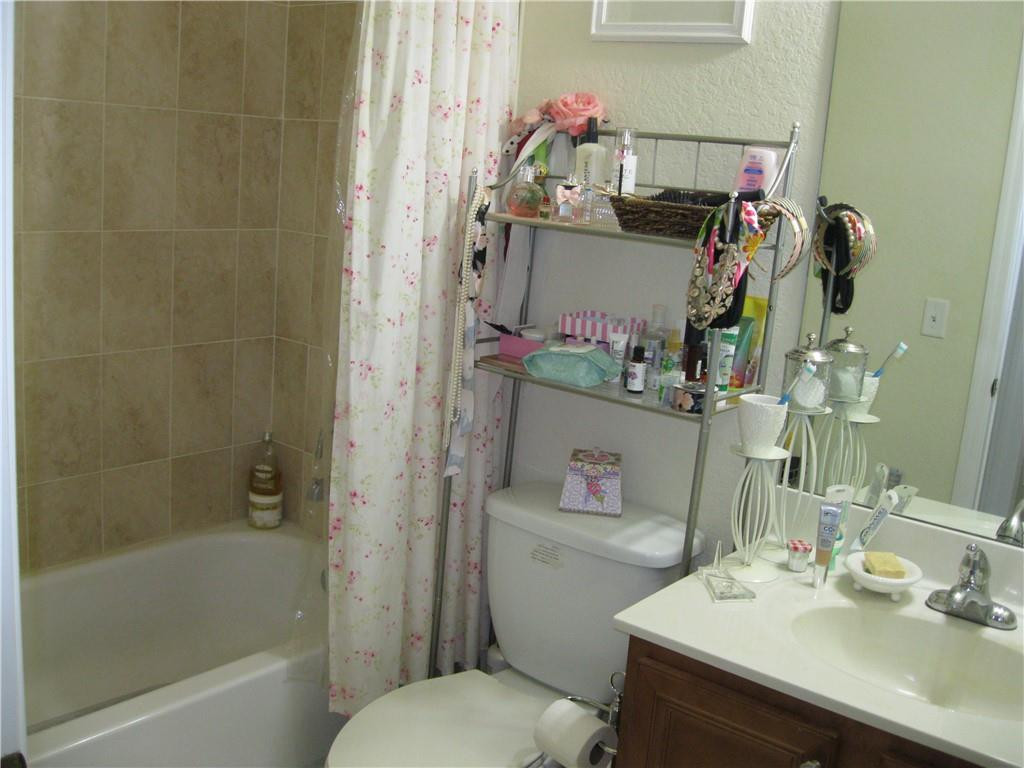 20767 Northeast 10th Path, Unit 20767 Miami, FL 33179 - Photo 17 of 26 a bathroom with a sink toilet and shower