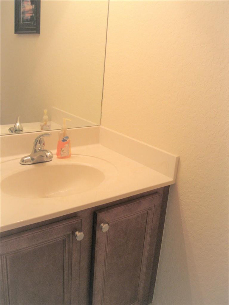 20767 Northeast 10th Path, Unit 20767 Miami, FL 33179 - Photo 18 of 26 a close up of a sink and a mirror