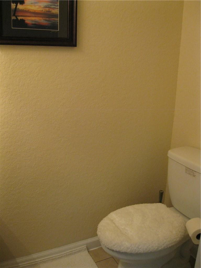 20767 Northeast 10th Path, Unit 20767 Miami, FL 33179 - Photo 19 of 26 a bathroom with a toilet