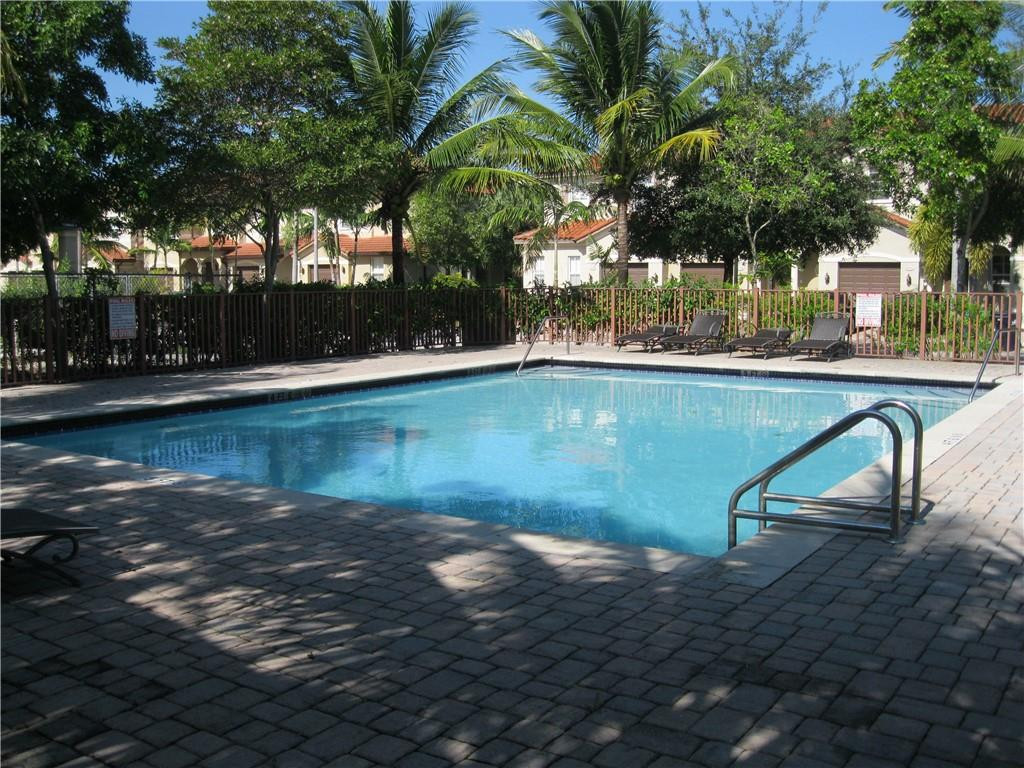 20767 Northeast 10th Path, Unit 20767 Miami, FL 33179 - Photo 25 of 26 a view of swimming pool with a yard