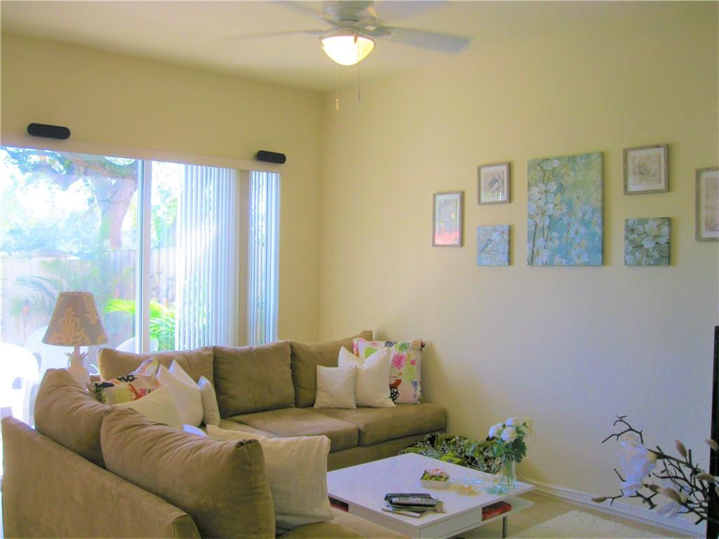 20767 Northeast 10th Path, Unit 20767 Miami, FL 33179 - Photo 6 of 26 a living room with furniture and a large window