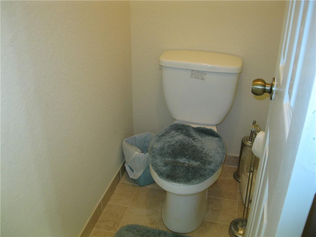 20767 Northeast 10th Path, Unit 20767 Miami, FL 33179 - Photo 7 of 26 a white toilet sitting next to a sink