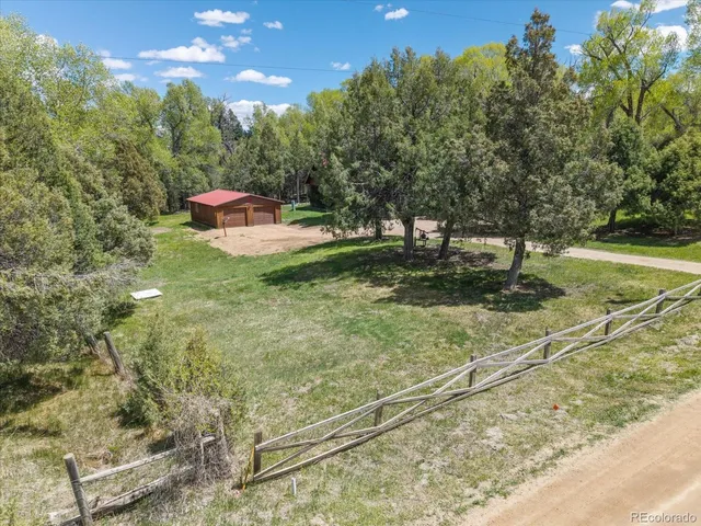 a view of a garden with a street
