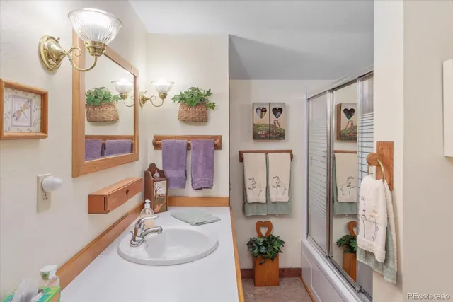 a bed room with a bed and a chair