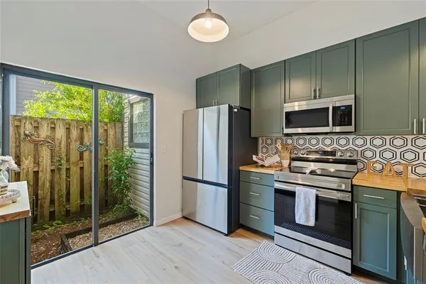 a kitchen with a stove microwave and refrigerator