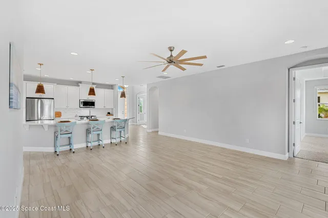 a view of kitchen with cabinets and wooden floor