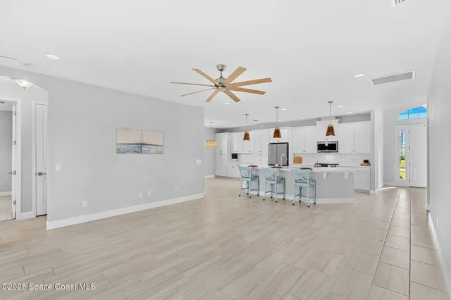 a view of dining room with furniture and wooden floor