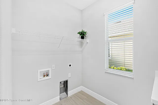 a view of an entryway with wooden floor