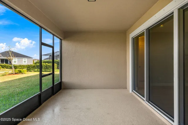 a view of an empty room and window