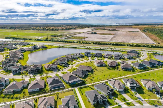 a view of a swimming pool with an outdoor space and seating area