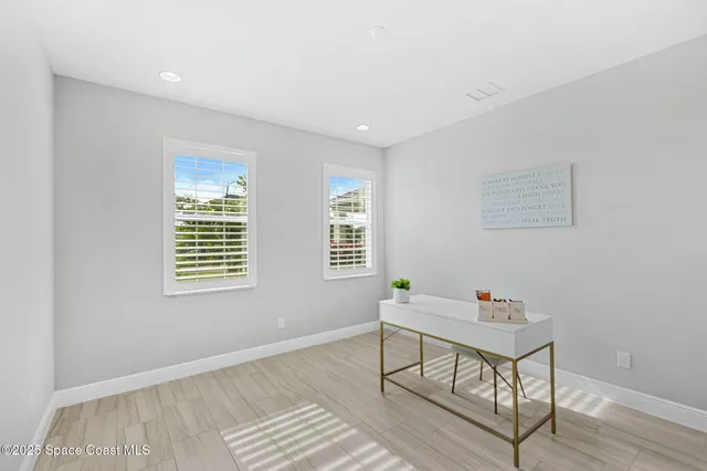 a workspace with furniture and window