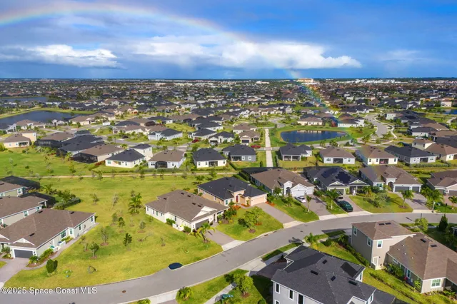 an aerial view of residential houses with outdoor space