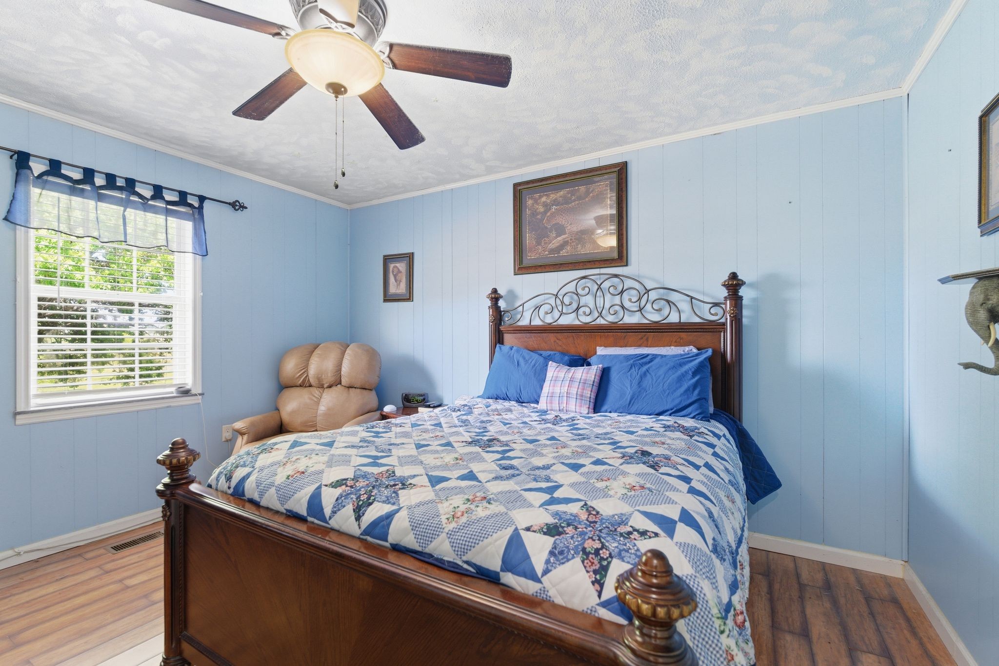 404 Logan Chapel Road Hillsboro, TN 37342 - Photo 21 of 38 a bedroom with a bed and a lamp on dresser