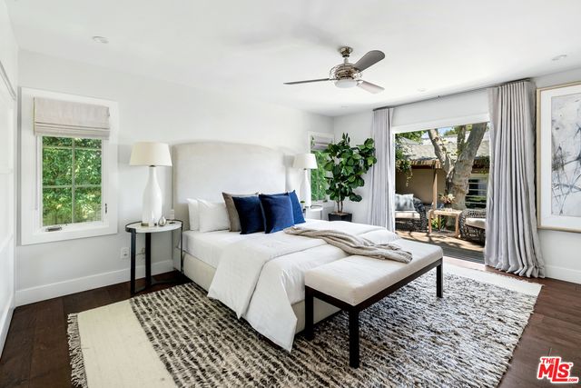 a bed room with a bed and a window