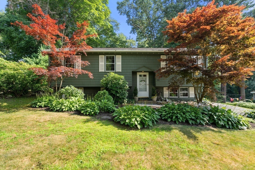 front view of a house with a yard