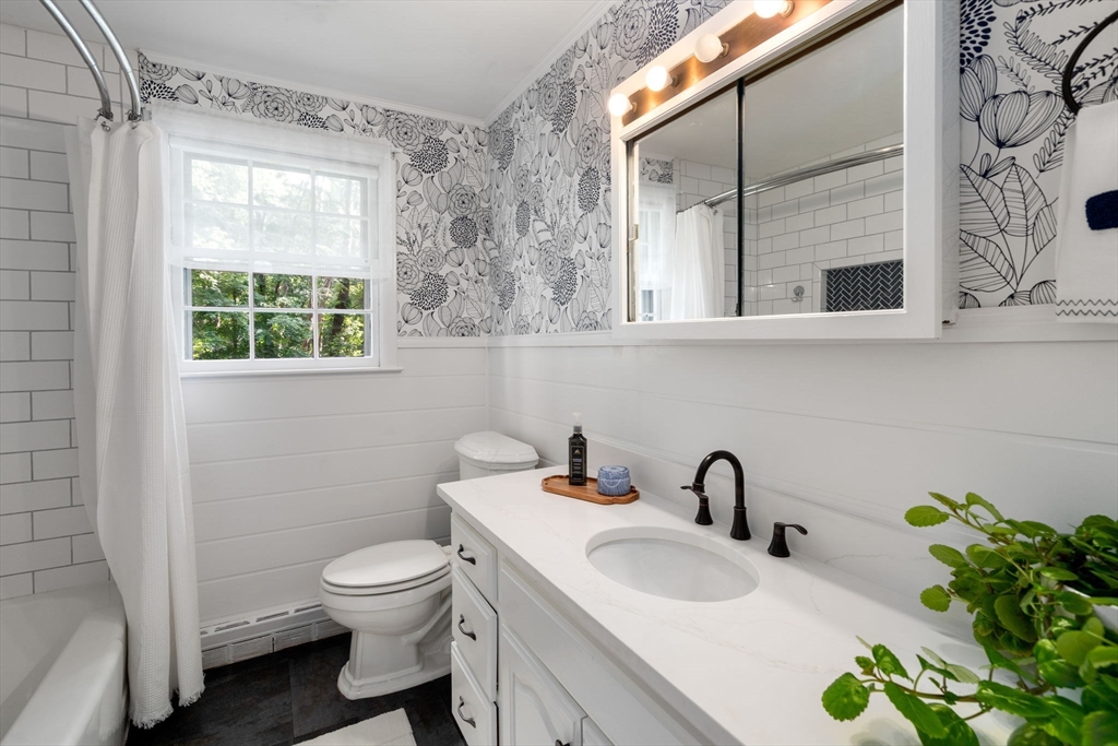 330 Gorwin Drive Holliston, MA 01746 - Photo 12 of 27 a bathroom with a toilet sink and mirror