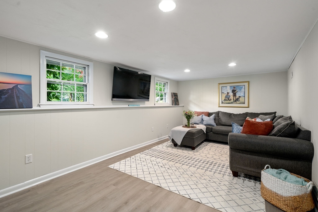 330 Gorwin Drive Holliston, MA 01746 - Photo 17 of 27 a living room with furniture window and a flat screen tv
