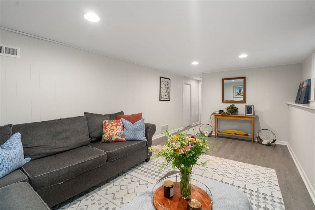 330 Gorwin Drive Holliston, MA 01746 - Photo 18 of 27 a living room with furniture flowerpot and a rug