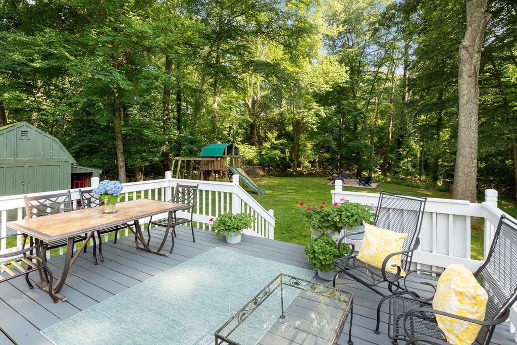 330 Gorwin Drive Holliston, MA 01746 - Photo 21 of 27 a balcony with wooden floor table and chairs