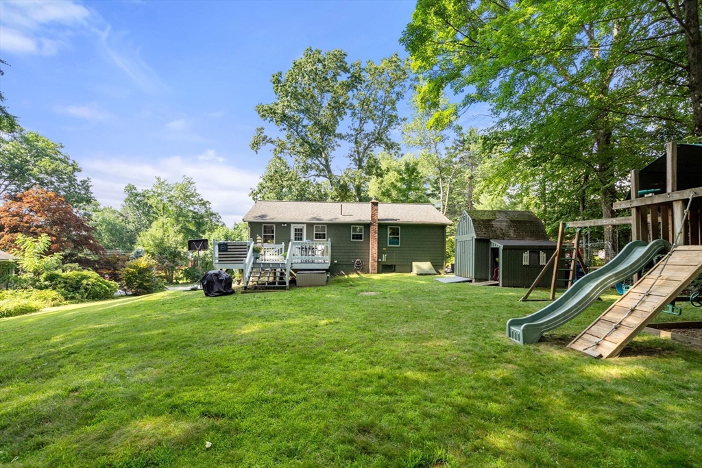 330 Gorwin Drive Holliston, MA 01746 - Photo 23 of 27 a view of a house with a yard
