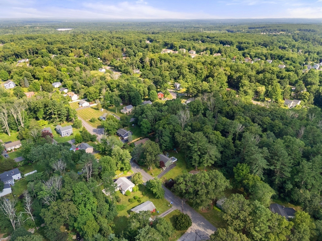 330 Gorwin Drive Holliston, MA 01746 - Photo 26 of 27 a view of a green field with lots of bushes