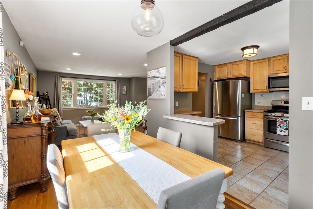 330 Gorwin Drive Holliston, MA 01746 - Photo 10 of 27 a large kitchen with a table and chairs