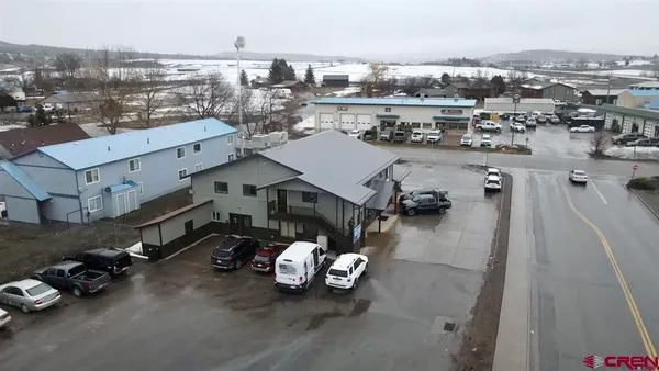 an aerial view of a house with a parking space