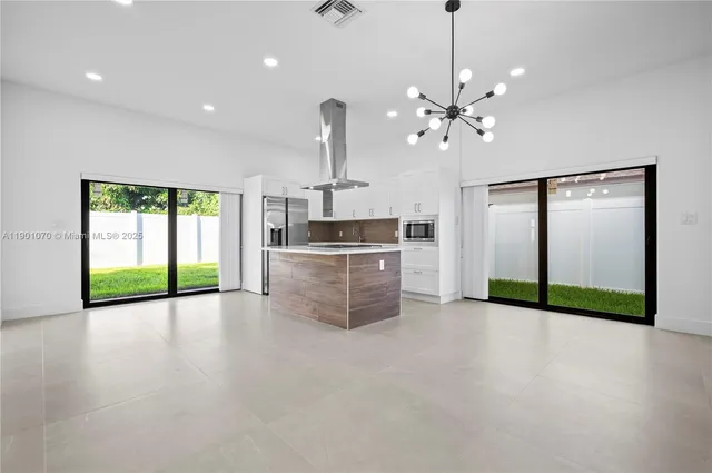 a view of a kitchen with a sink and a kitchen floor