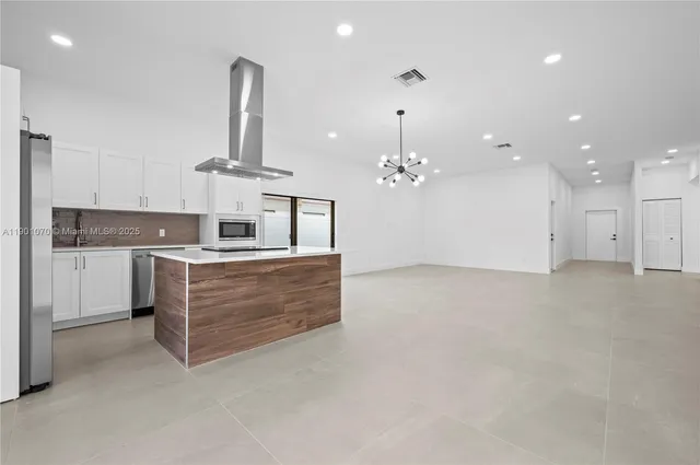 a large kitchen with cabinets