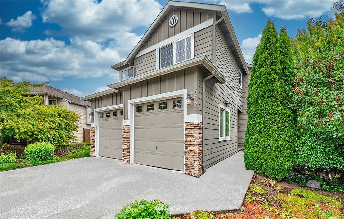 17029 4th Avenue Southeast Bothell, WA 98012 - Photo 2 of 23 a front view of a house with a garden