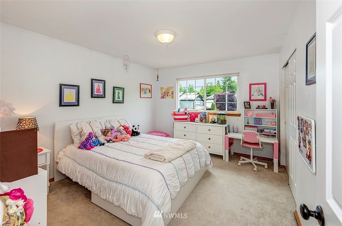 17029 4th Avenue Southeast Bothell, WA 98012 - Photo 12 of 23 a bedroom with a bed and a desk