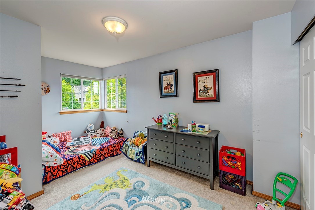 17029 4th Avenue Southeast Bothell, WA 98012 - Photo 13 of 23 a bedroom with bed and a window