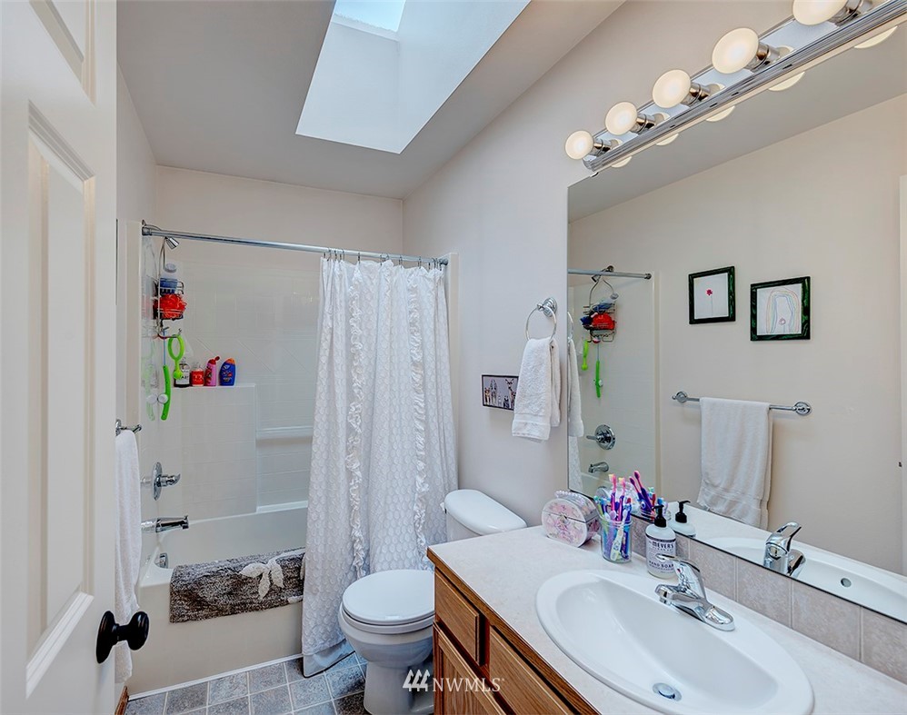 17029 4th Avenue Southeast Bothell, WA 98012 - Photo 15 of 23 a bathroom with a sink toilet and shower