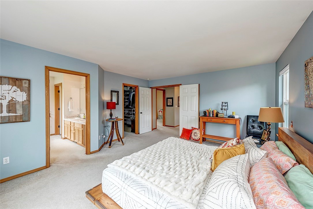 17029 4th Avenue Southeast Bothell, WA 98012 - Photo 8 of 23 a bed room with a bed and a tv