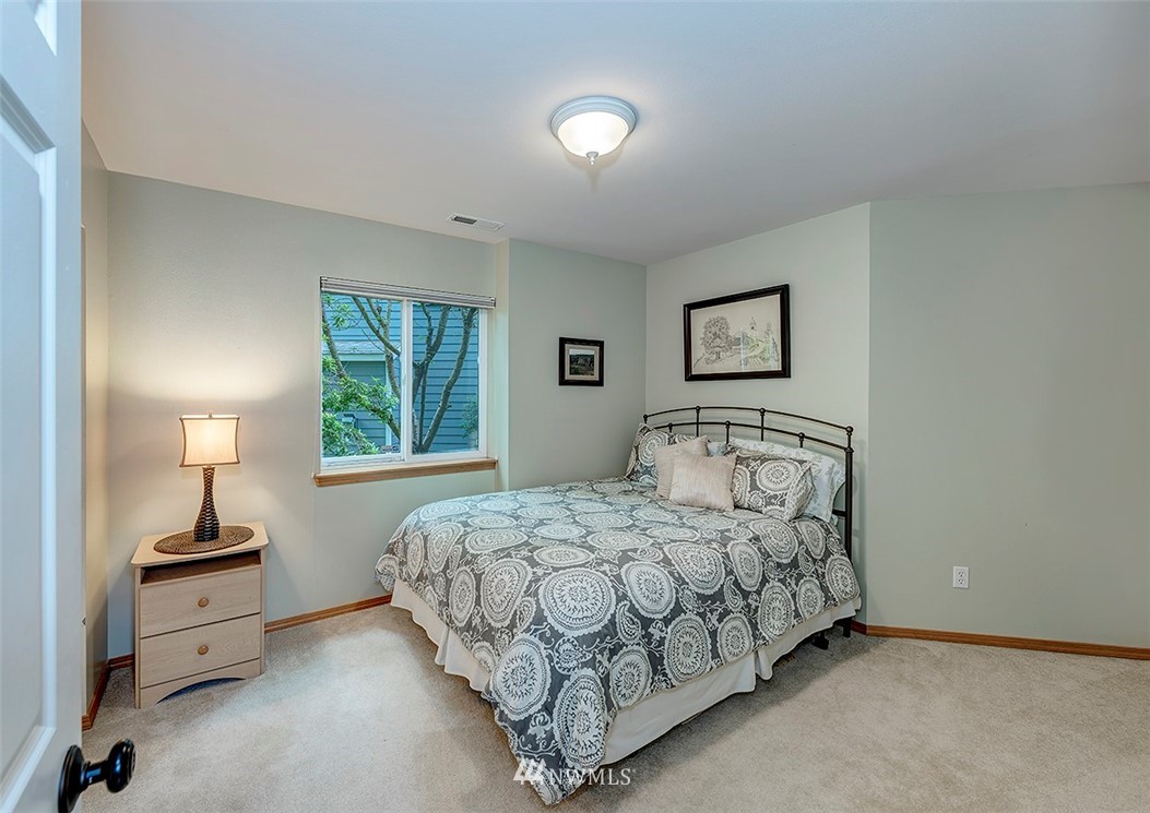 17029 4th Avenue Southeast Bothell, WA 98012 - Photo 10 of 23 a bedroom with a bed and a night stand