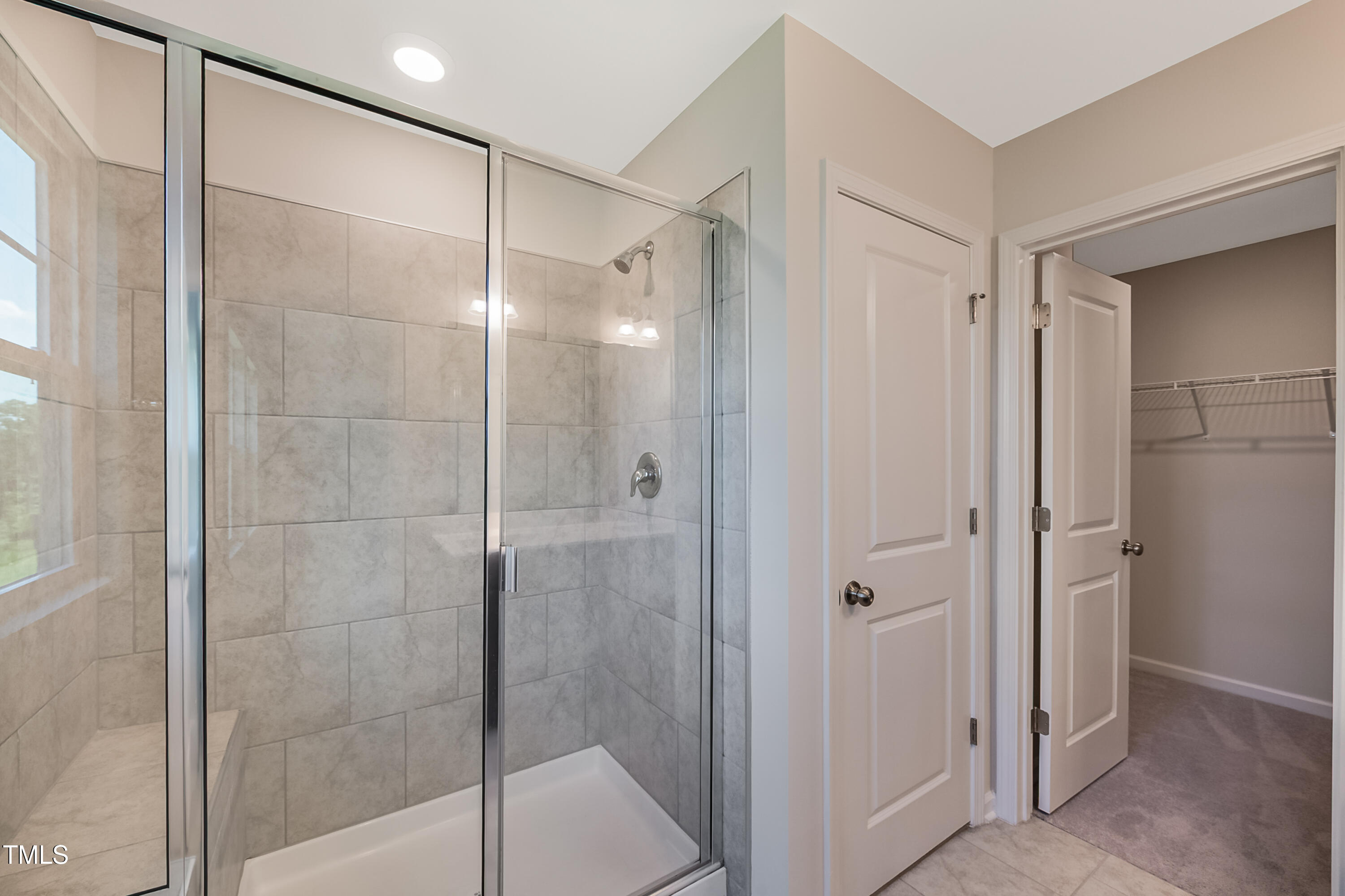 1032 Shoreside Drive Durham, NC 27713 - Photo 14 of 31 a bathroom with a glass shower door