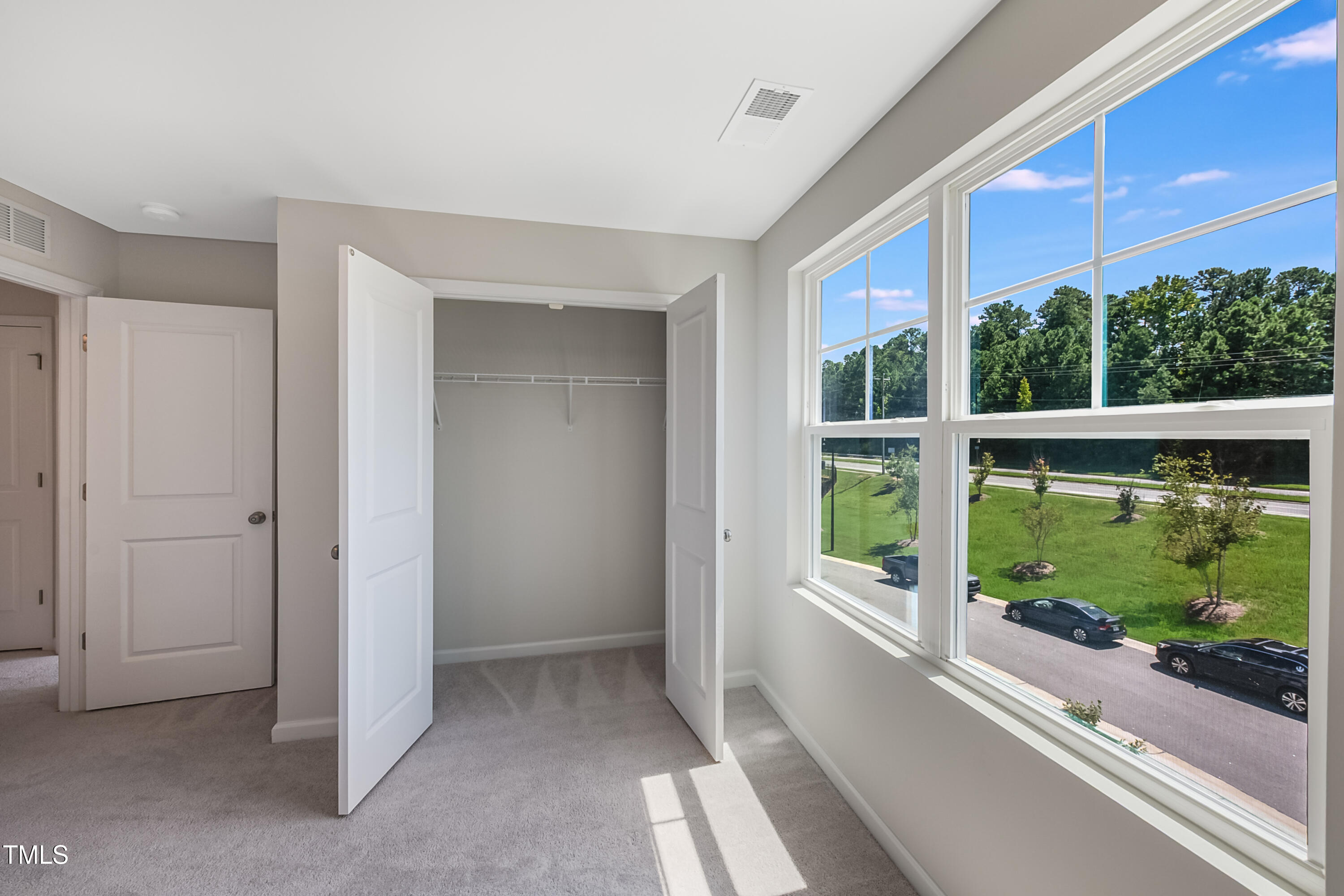 1032 Shoreside Drive Durham, NC 27713 - Photo 18 of 31 a view of a house with a large window