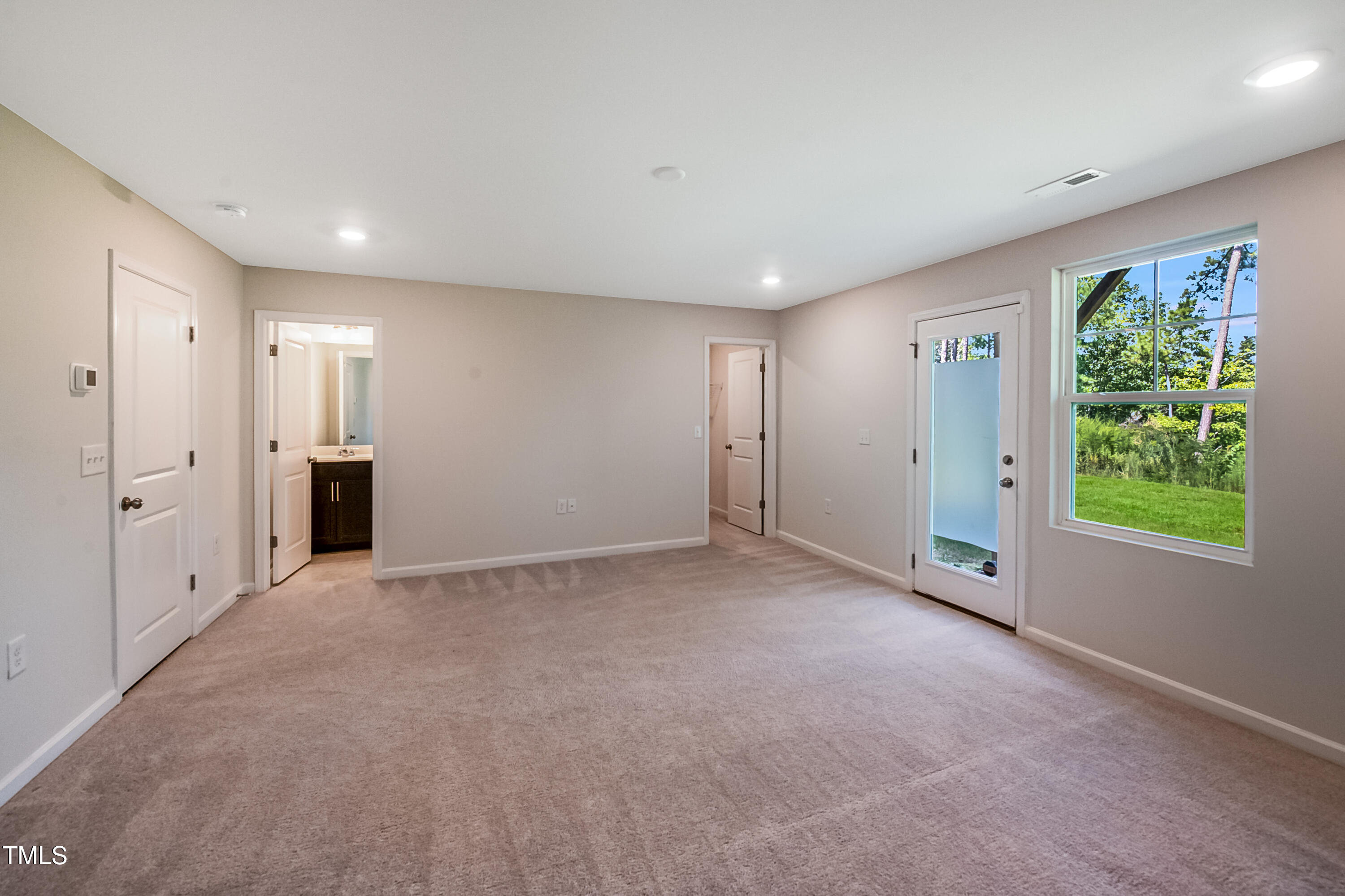 1032 Shoreside Drive Durham, NC 27713 - Photo 22 of 31 a view of an empty room with a window