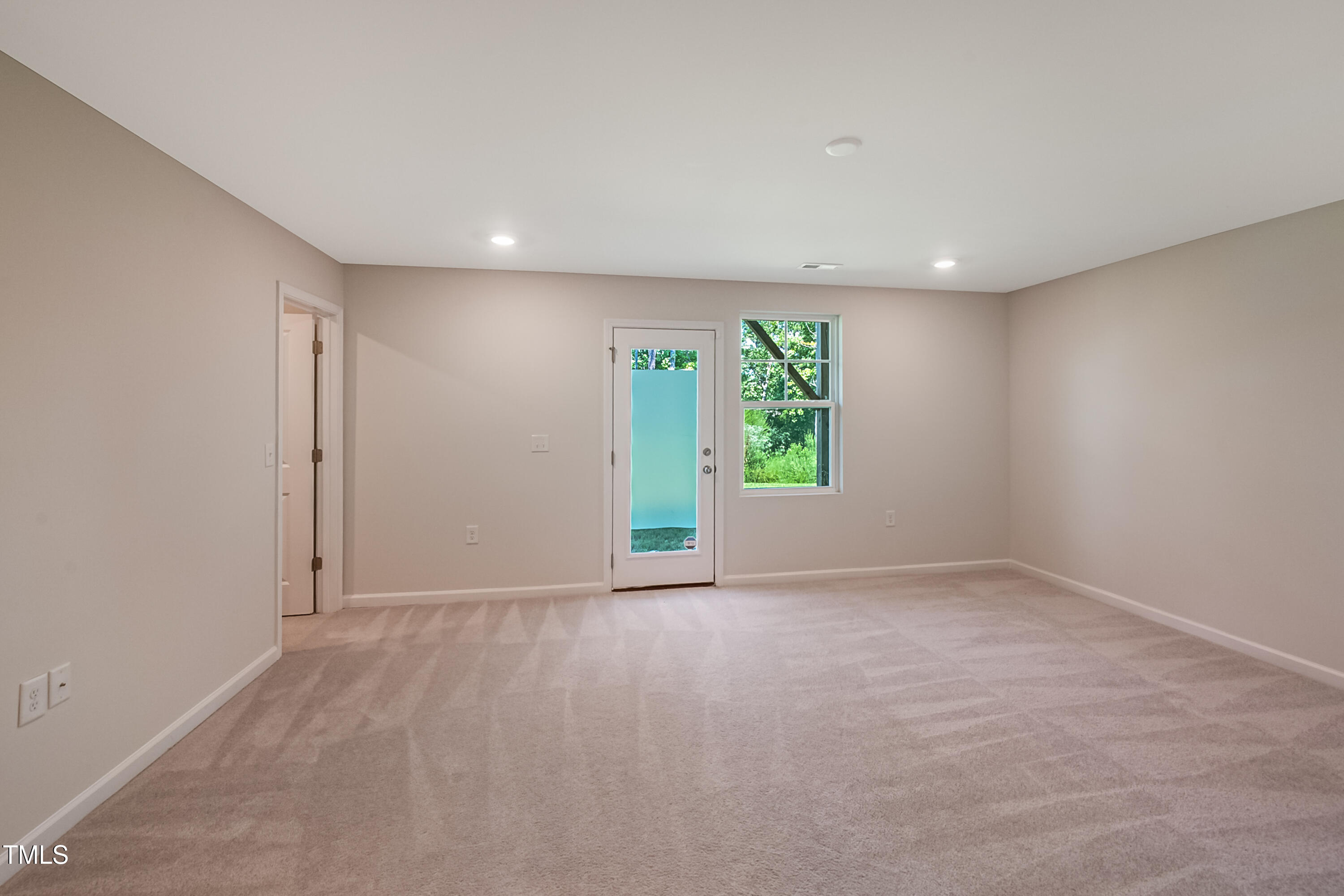 1032 Shoreside Drive Durham, NC 27713 - Photo 23 of 31 a view of an empty room with a window
