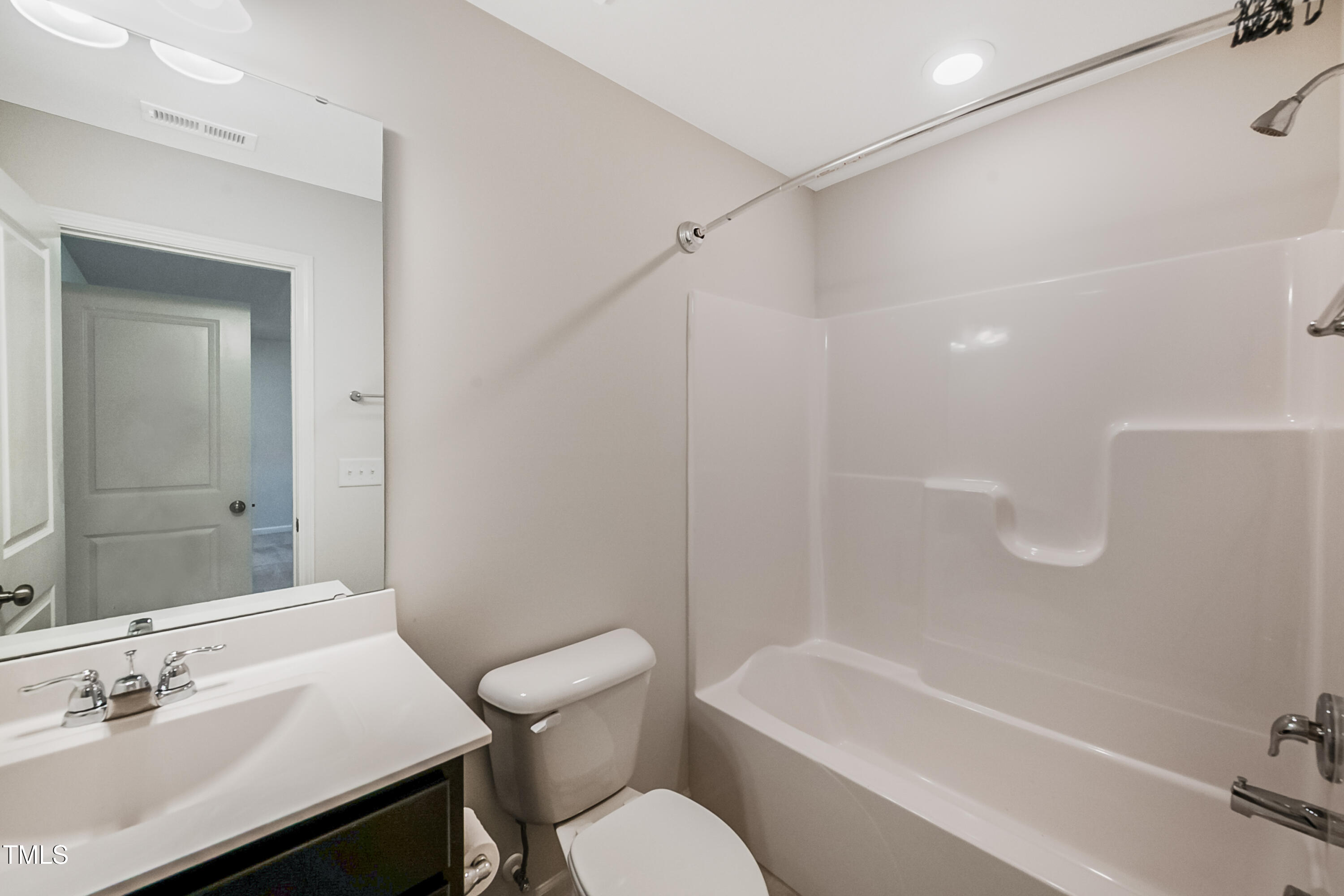 1032 Shoreside Drive Durham, NC 27713 - Photo 24 of 31 a bathroom with a sink a toilet and shower