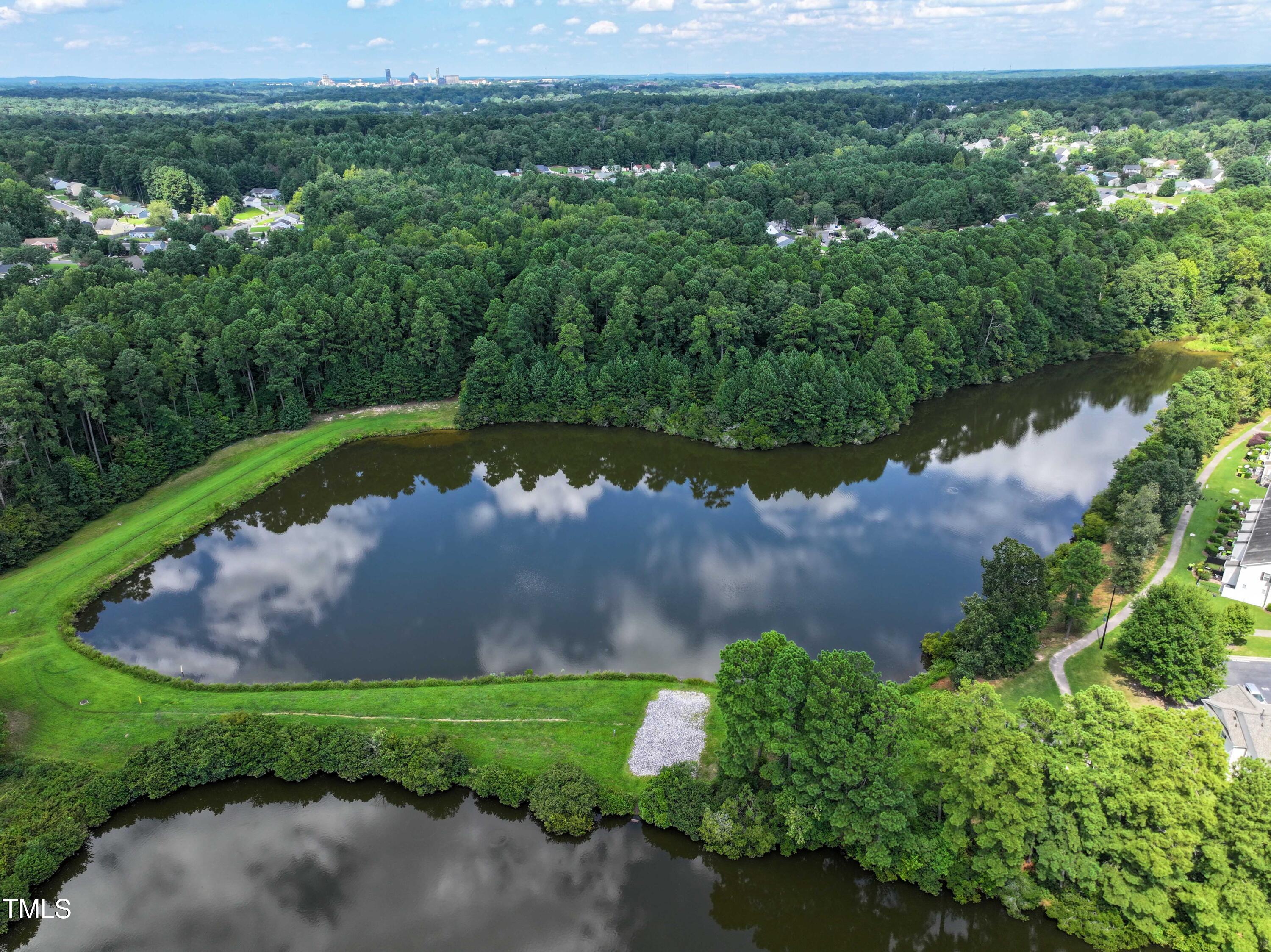 1032 Shoreside Drive Durham, NC 27713 - Photo 30 of 31 an aerial view of a house with a garden and lake view