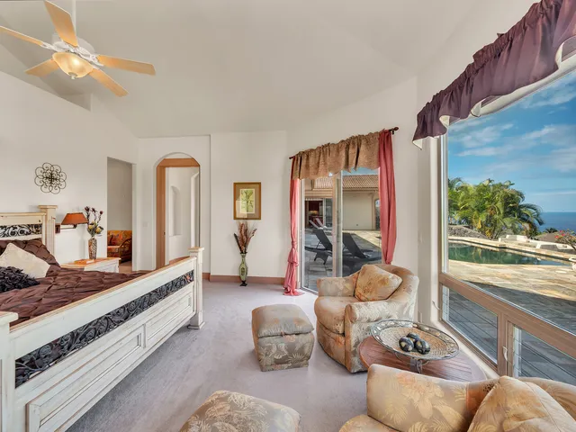 a room with furniture and a large window