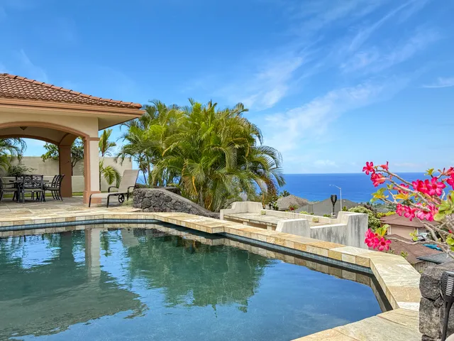 a view of swimming pool with a sitting area