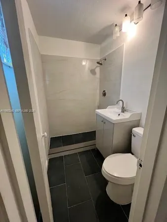 a bathroom with a sink and a toilet