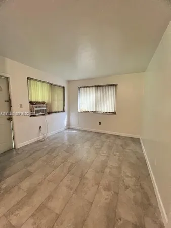 a kitchen with stainless steel appliances granite countertop a stove a refrigerator and a sink