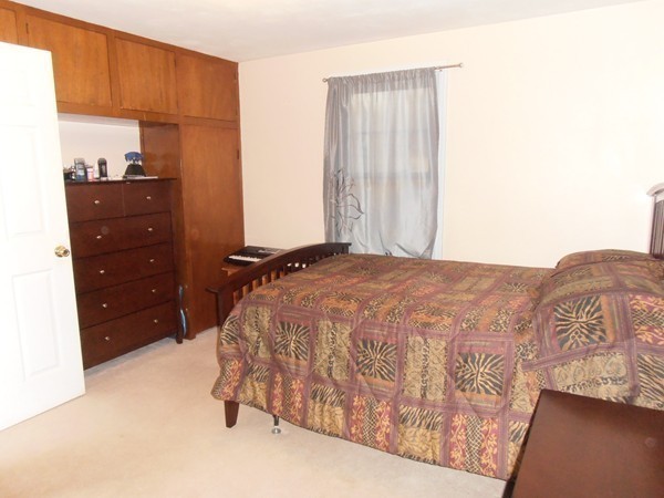 199 Eddy Street Springfield, MA 01104 - Photo 8 of 21 a bedroom with a bed and a window
